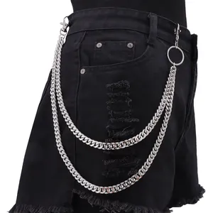 Double-layer silver metal wallet chain with lobster clasps on black denim shorts