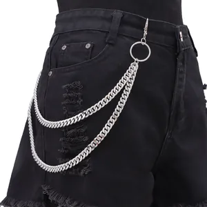 Detail of silver double-layered metal trousers chain with lobster clasp on black jeans