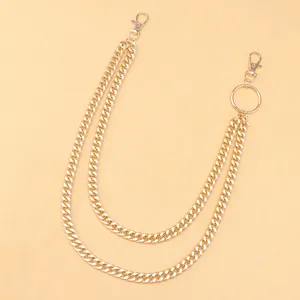 Detail view of double-layer gold Cuban link pants chain with lobster clasp and ring