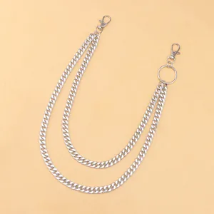 Detail of silver double-layered metal curb chains with lobster clasps for trousers