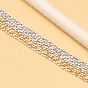 Detail of silver and gold Cuban link chains with diamond-cut stardust finish texture