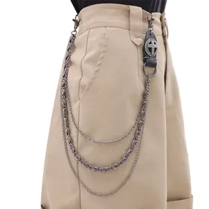 Close-up of triple-layered silver metal pants chain with leather cross accent