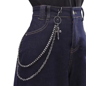 Double-layered metallic trouser chain with gothic cross skull charm on denim