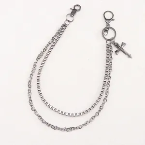 Close-up of a dual-layer gunmetal trousers chain featuring a dragonfly punk pendant