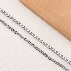 Detailed macro view of silver box chain and link chain with polished metal texture