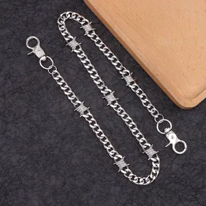 Detail of silver punk waist chain with barbed wire links and large lobster clasps