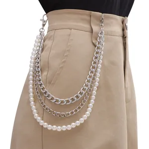 Close-up of double-layer silver metal chain with pearls and lobster clasp on waist