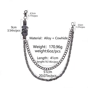 Detail of punk style dual metal wallet chains with cowhide and skull charms in gun black
