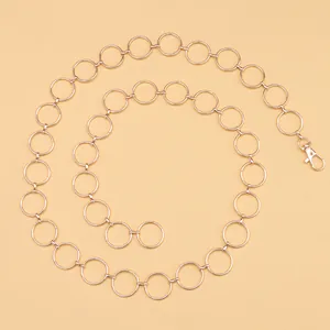 Stylish rose gold metal chain belt featuring interlocking round rings and lobster clasp