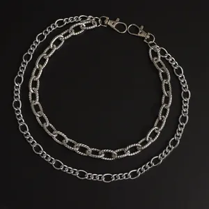 Detail of silver double-layered punk hip-hop chain with carved floral links and lobster clasps