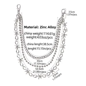 Detail of silver multi-layer punk pants chain with thorns and lobster clasps on white