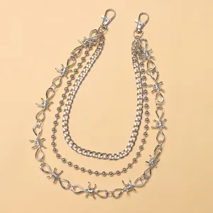Detail of silver multi-layer metal chain with barbed wire links and lobster clasps