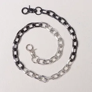 Detail of dual-color hip-hop pant chain in polished silver and black metallic finish