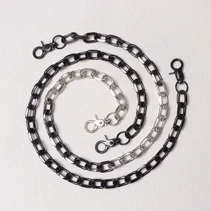 Close-up of a dual-tone black and silver hip-hop chain with secure swivel lobster clasps