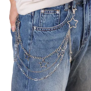 Detail of silver multi-layer metal waist chain with hollow stars on denim jeans