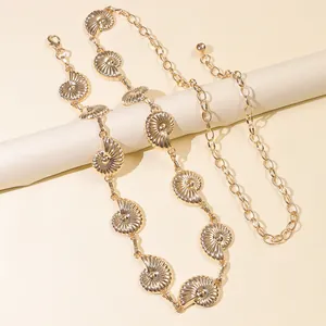 Golden sea shell waist chain belt with spiral nautilus charms and lobster clasp closure
