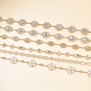 Detail of six vintage gold metal waist chains with sunflowers and rhinestones