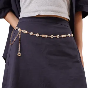 Detailed macro view of golden metal sunflower waist chain with sparkling crystals