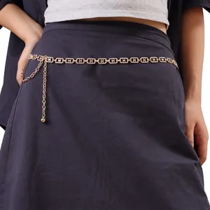 Macro view of a sparkling gold rhinestone waist chain belt for dress decoration