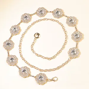Detail of sunflower waist chain with sparkling crystals and golden metallic petals