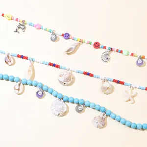 Detail of colorful bohemian shell necklaces with starfish and smiley face beads
