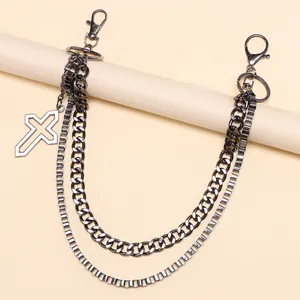 Detail of gun-black double-layer pant chain with cross pendant and metal lobster clasps