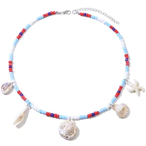 Detail of bohemian necklace with colorful beads, natural seashells and starfish charms