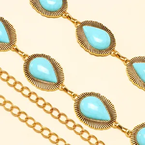 Bohemian gold waist chain featuring turquoise teardrop stones in a vintage filigree design