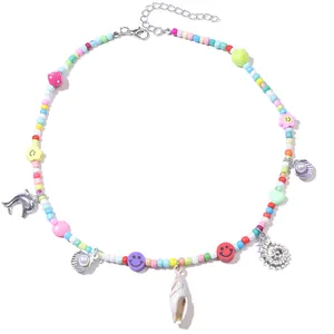 Bohemian colorful beaded necklace set with dolphin and seashell pendants in a round layout