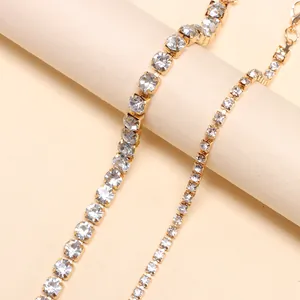 Adjustable golden tennis bracelet set with sparkling square zircons in a layered style