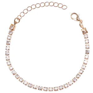 Macro detail of adjustable gold tennis bracelet featuring four-prong cubic zirconia stones