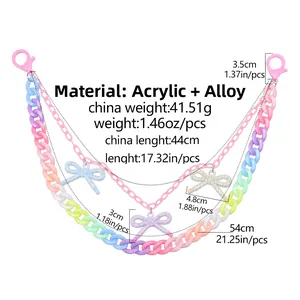 Detail view of 54cm acrylic bow pant chain with pink carabiners and alloy layers