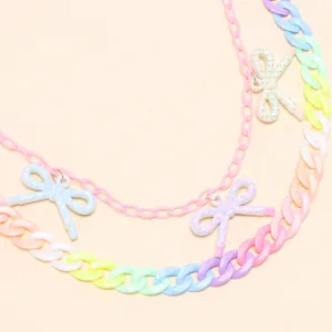 Macro shot of multi-layer rainbow acrylic chain with colorful bow charms for girls
