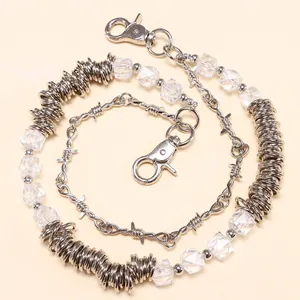 Detail view of punk silver chain with wire thorns, square beads and lobster clasps