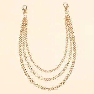 Close-up of triple-layered gold metal hip-hop pants chain with lobster clasps