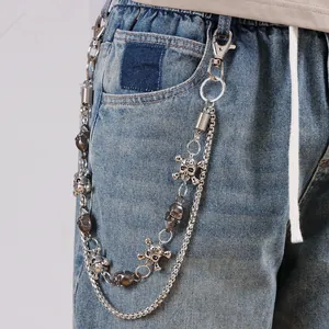 Double-layered skull pendant pants chain with silver spring clasps on denim jeans