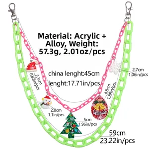 Detail of Christmas acrylic pant chain with snowman, tree and snowflake charms on double layers