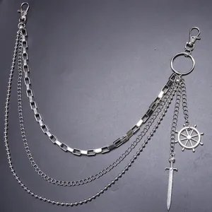 Close-up of multi-layer silver hip hop wallet chain with sword and helm charms