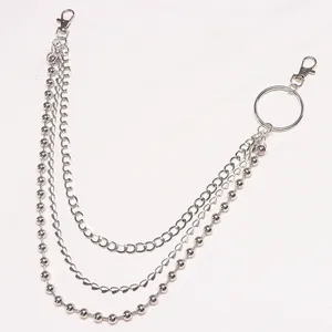 Silver multi-layer pants chain with heart pendant and metal beads on white background