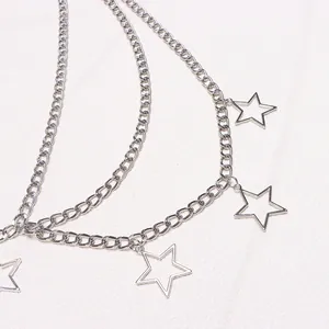 Detail showing layers of silver metal chains with hollow star pendants in high quality