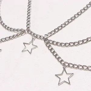 Silver layered metal waist chain with hollow star pendants in a hip-hop trendy style