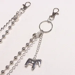 Detail of silver double-layered pants chain with pony pendant and lobster clasps