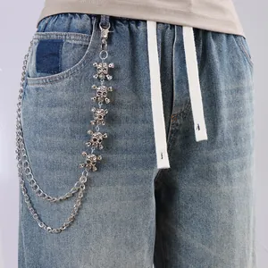 Gothic punk silver trousers chain featuring skull charms on blue denim jeans