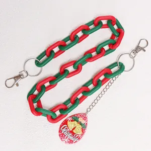 Detail of red and green acrylic Christmas chain with metal clasps and festive pendant