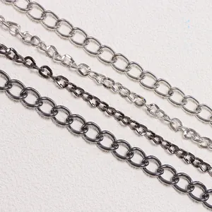 Close-up of gothic silver and gunmetal skull pant chains with varying link sizes