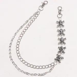 Close-up of triple-layered silver metal wallet chain with skull and crossbones charms