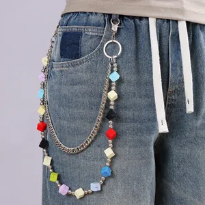 Double-layer hip-hop pant chain with colorful cube beads and metal Cuban links on blue jeans