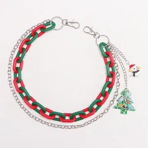 Detailed view of Christmas themed acrylic chain with snowman and tree charms