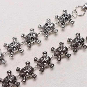 Gothic punk metal pants chain featuring skull and crossbones with blue stone eyes