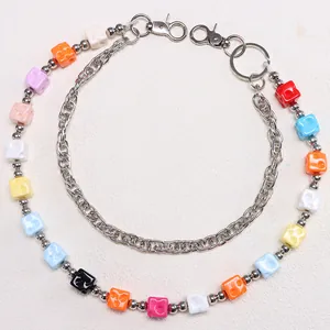 Detail of colorful double-layer pant chain with acrylic cube beads and silver metal clasps